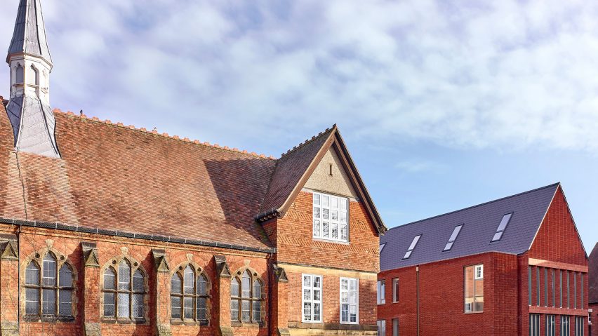 New gabled extension next to red brick Victorian structure