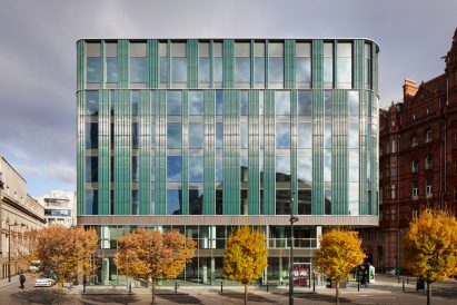 Green terracotta tiles on facade of office building
