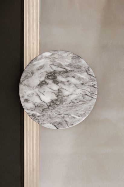 Bathroom of Zuppa restaurant with marble handles