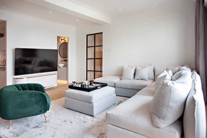 White sofa with a jade green easy chair