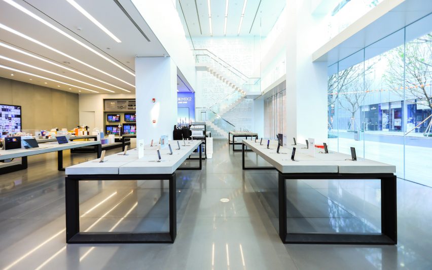 White tables inside Xiaomi flagship store