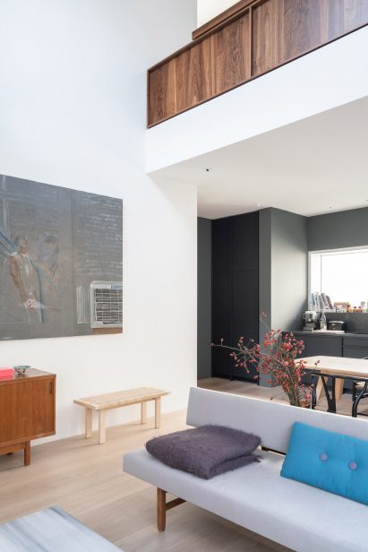 The mezzanine level has a walnut balustrade
