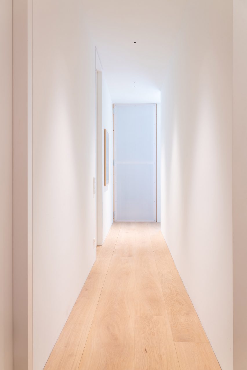 Pale wood floors run through the interior