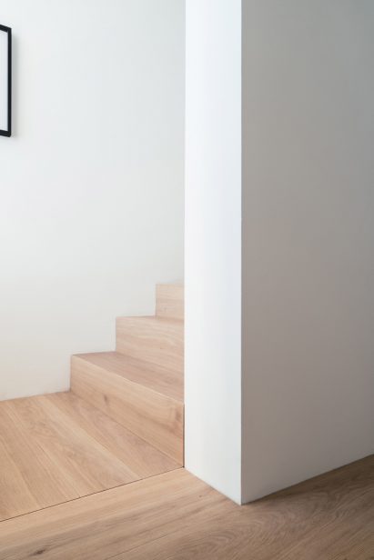 The interior has white walls wooden floors