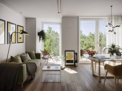 Interior view of an apartment with views out to tree-line 