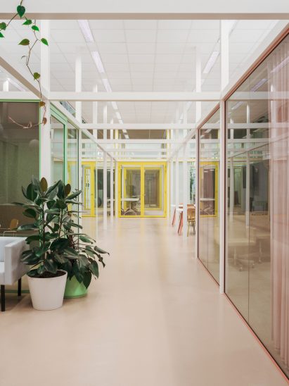 White framework houses colourful windows and doors