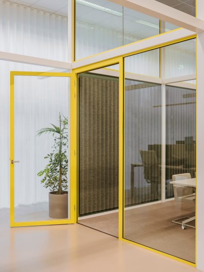 Carpet and felt covers the walls and floors in the enclosed office spaces