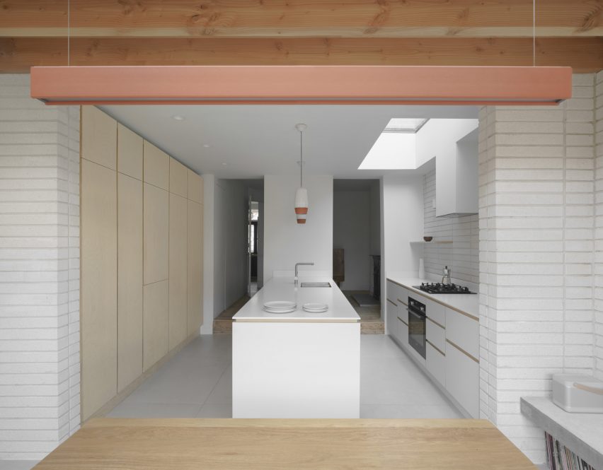 The white kitchen of a house extension in London by DeDraft