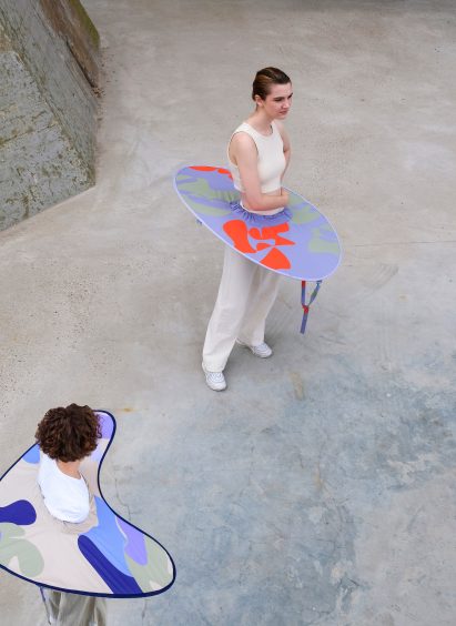 Aerial view of people wearing expanded distance keeper from the Bounding Spaces collection