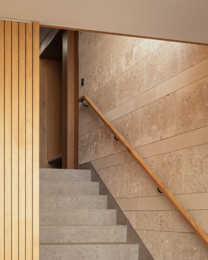 Stone stairs with wooden handrail
