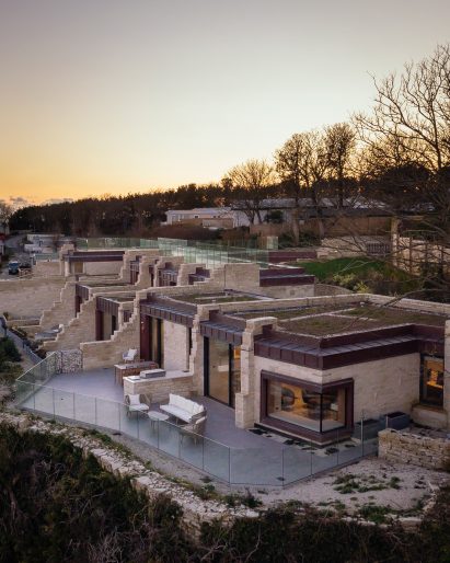 Pale stone clads the exterior of the lodges