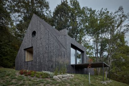 Charred-wood building on stilts 