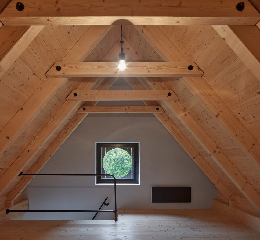 Circular cut out in the facade frames the outdoors