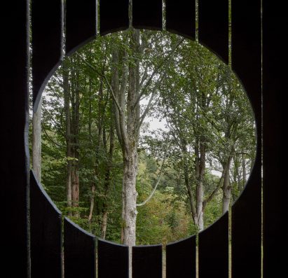 Circular window in wooden house