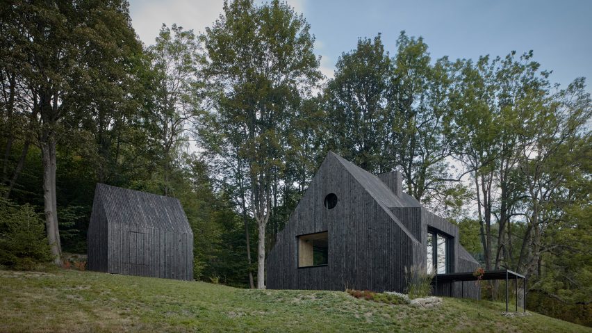Mjölk Architekti updates Czech cottage with burnt-wood cladding and revamped interior
