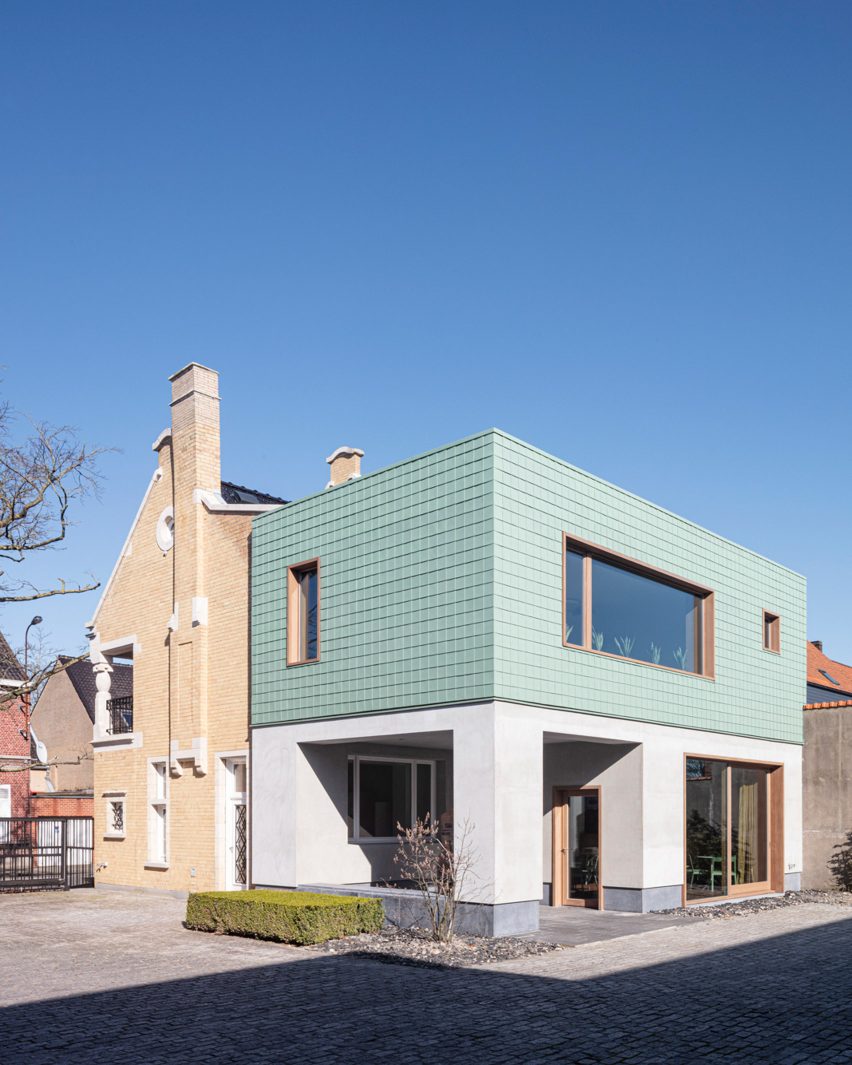 Grey plaster and copper cladding provides a contrast