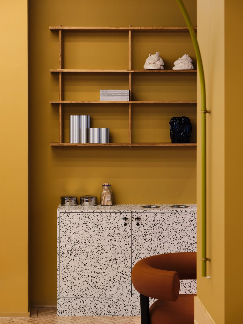 Yellow room with terrazzo furniture