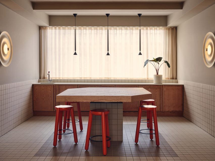 Durable materials and red chairs in Douglas House