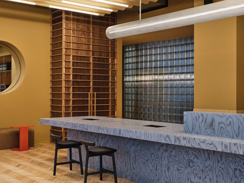Reception desk clad in Ettore Sottsass Alpi veneer in blue