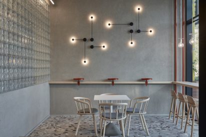 Standing orange clamp-style tables