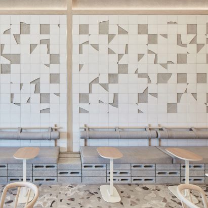 White ceramic mosaic and grey terrazzo floor in cafe