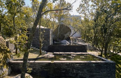 A reflective pool clad in slate