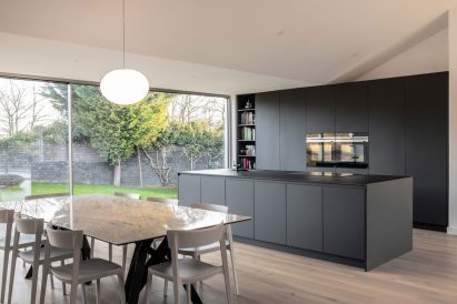 Kitchen of Honey and Walnut House by Intervention Architecture
