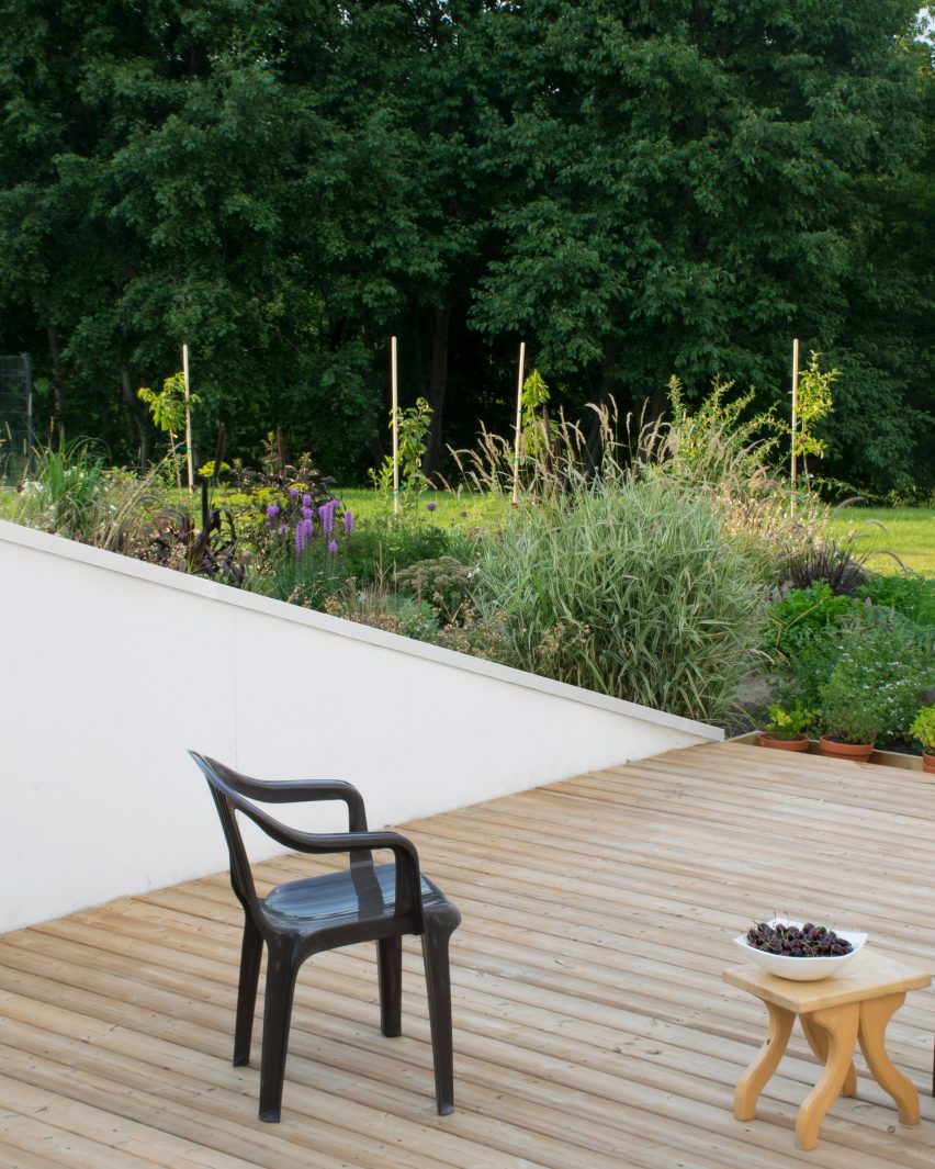 Living space and terrace in House and the River by After Party