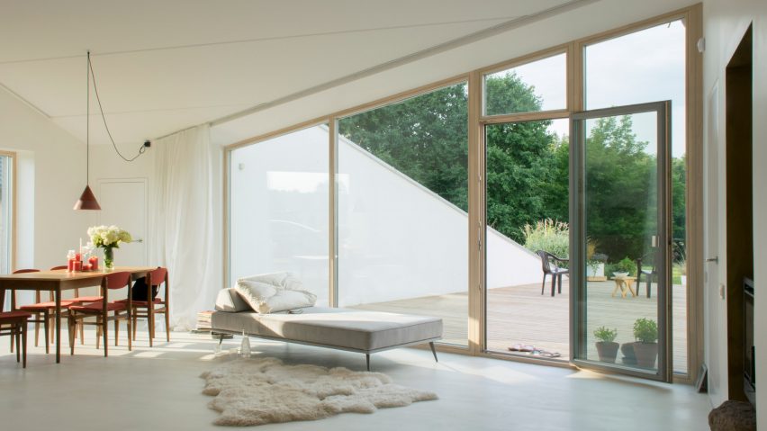 Living space and terrace in House and the River by After Party