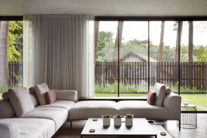 A glass-lined living room in a Scottish house by McGinlay Bell
