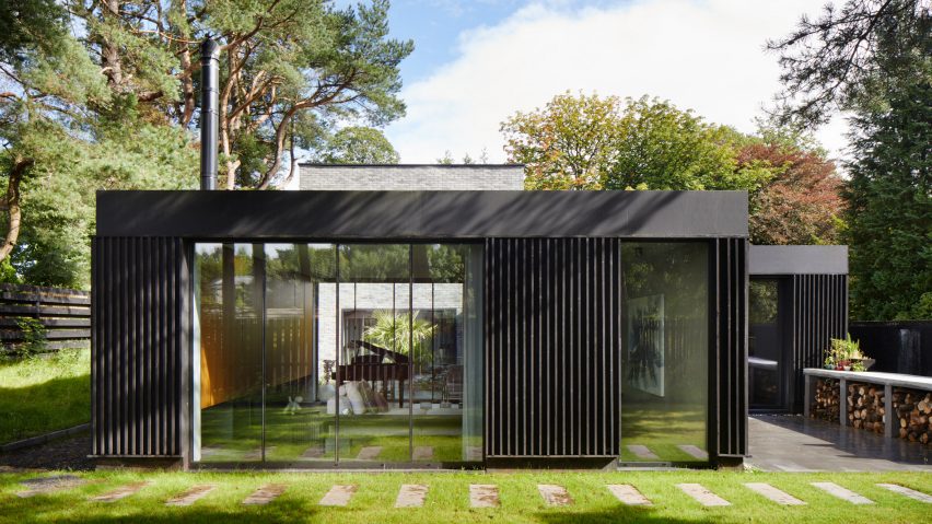 A timber-lined pavilion that forms part of a Scottish house by McGinlay Bell