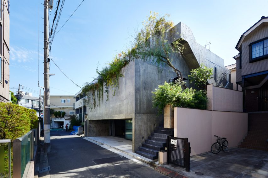 The exterior of a stepped concrete house in Japan