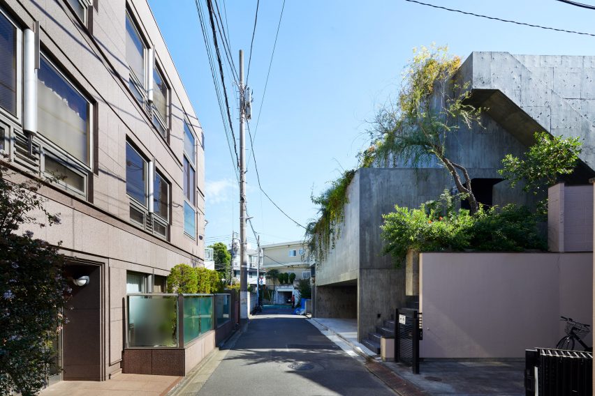 The exterior of a stepped concrete house in Japan
