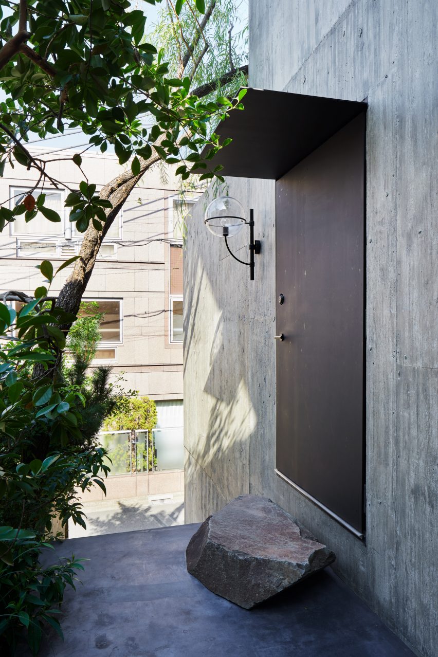 A concrete facade of a Japanese house
