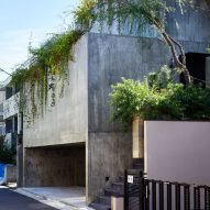 The exterior of a stepped concrete house in Japan