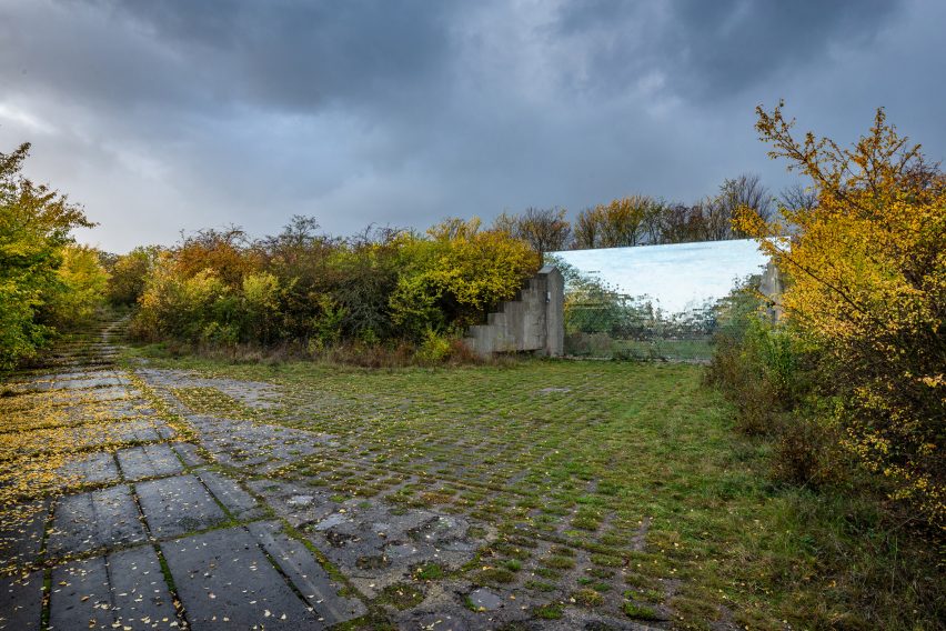 Mirrored pet crematorium at Drnov Air Defense Site by Petr Hájek Architekti