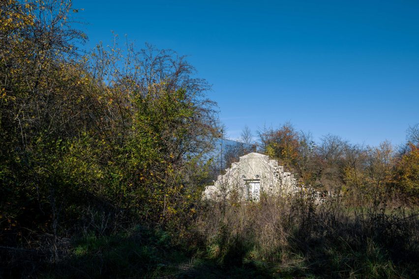 Mirrored pet crematorium at Drnov Air Defense Site by Petr Hájek Architekti