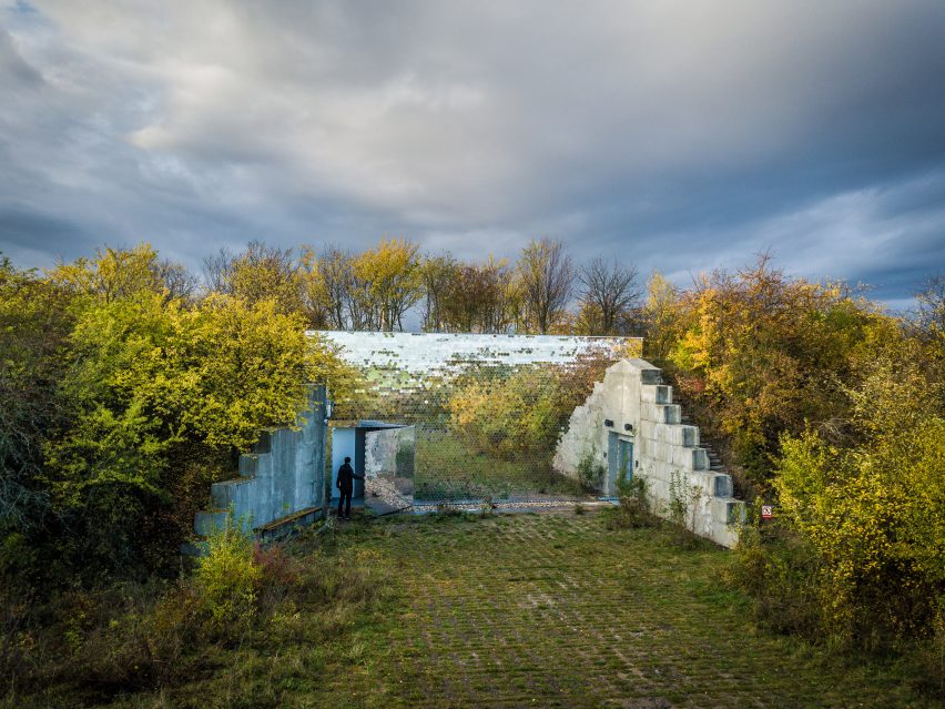Mirrored pet crematorium at Drnov Air Defense Site by Petr Hájek Architekti