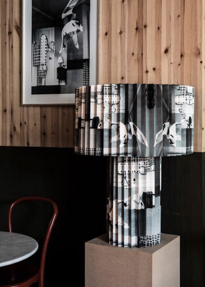 Black and white collage print on pleated lamp