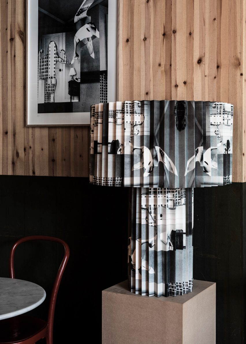 Black and white collage print on pleated lamp