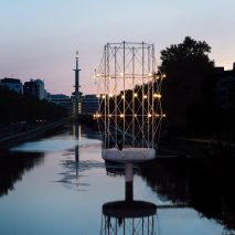 Small concrete and steel pavilion in a river
