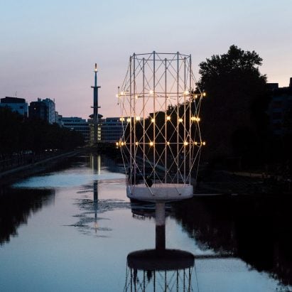 Small concrete and steel pavilion in a river