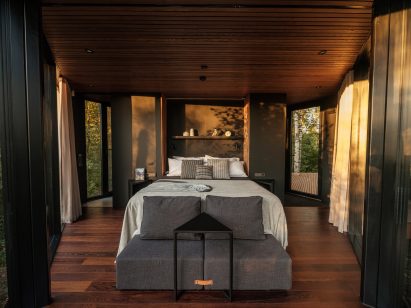 A wood-lined bedroom in a cabin in Estonia