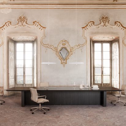 An office with a dark More conference table by Carlo Colombo