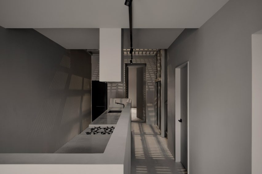 Greige kitchen with steel ceiling grid