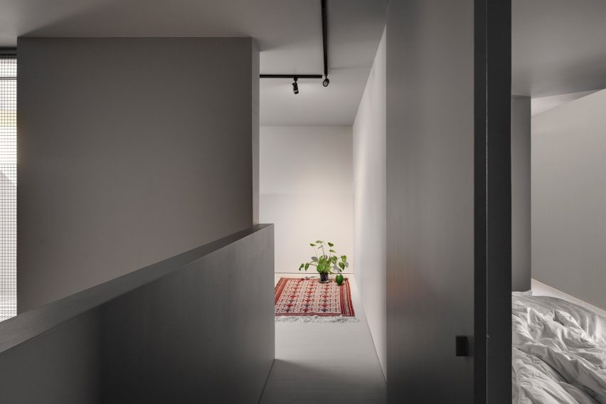 A flower on a rug in a greige living room