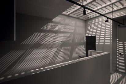 Low walls divide living areas in Montreal house