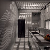 Shadows from steel structure in Montreal kitchen