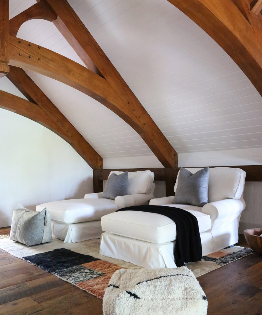 Plush sofabeds following the cottage's monochrome theme