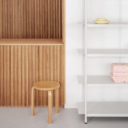 Wooden counter and white shelving in the OCE Copenhagen store interior by Aspekt Office